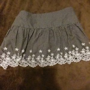 Poka dot bathing suit cover up flowers on the bott